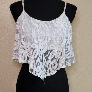 White cropped tank top with lace overlay.